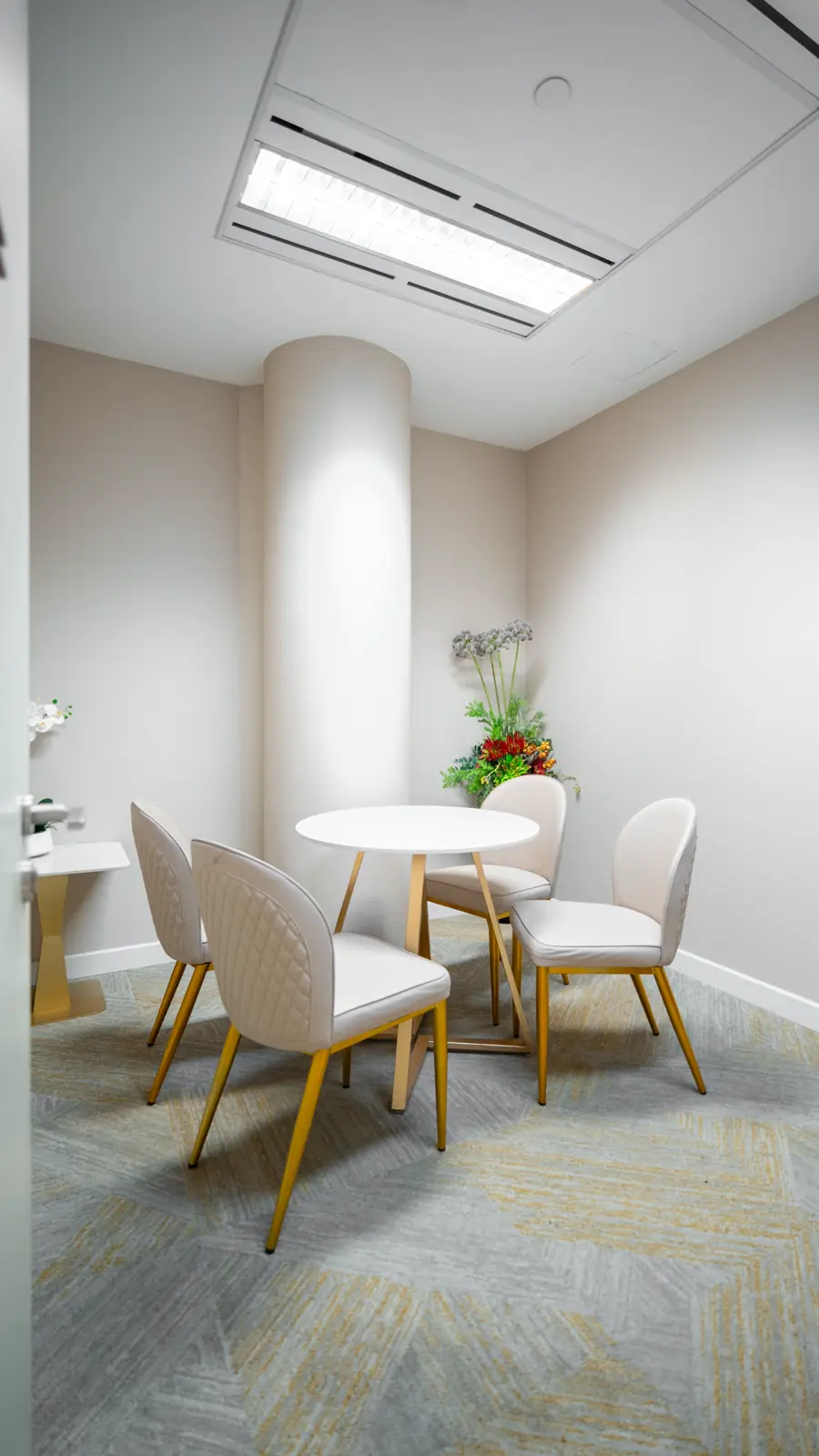 Private consultation room at Fusion Medical, with a round table and four chairs