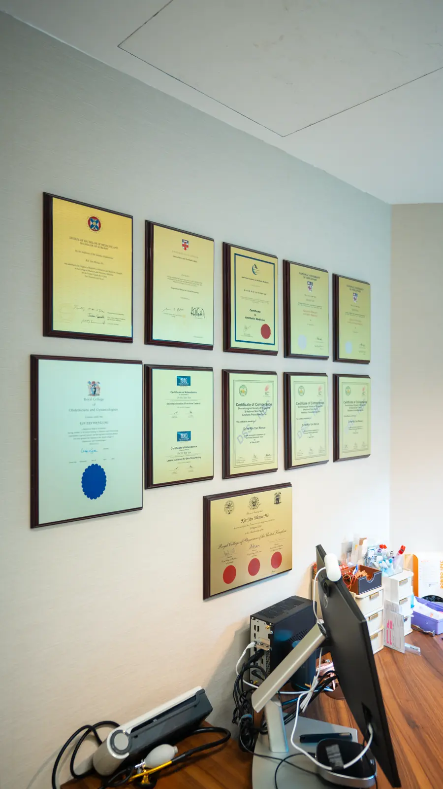 Framed medical training certificates in a Fusion Medical consultation room