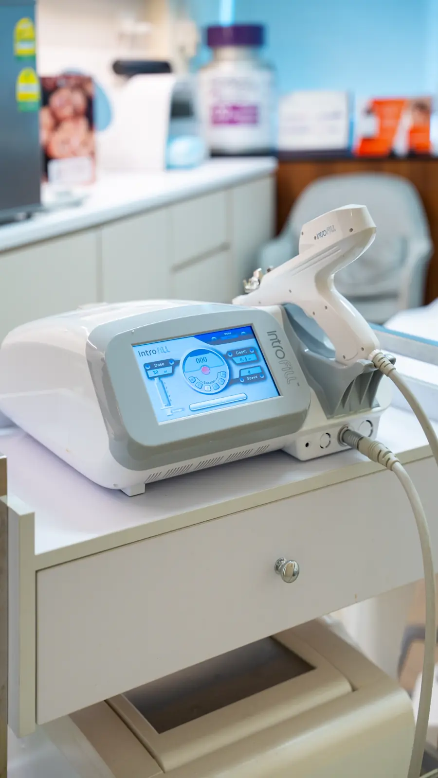 Skin booster injector with a touchscreen control unit on a treatment trolley at Fusion Medical