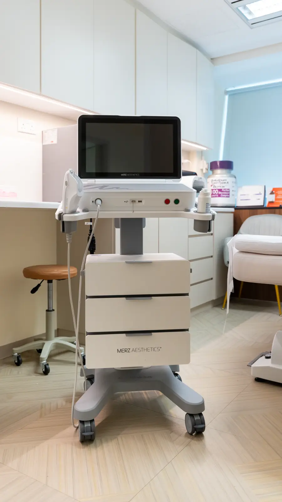 Ultherapy system cart with its screen and transducer in a Fusion Medical treatment room