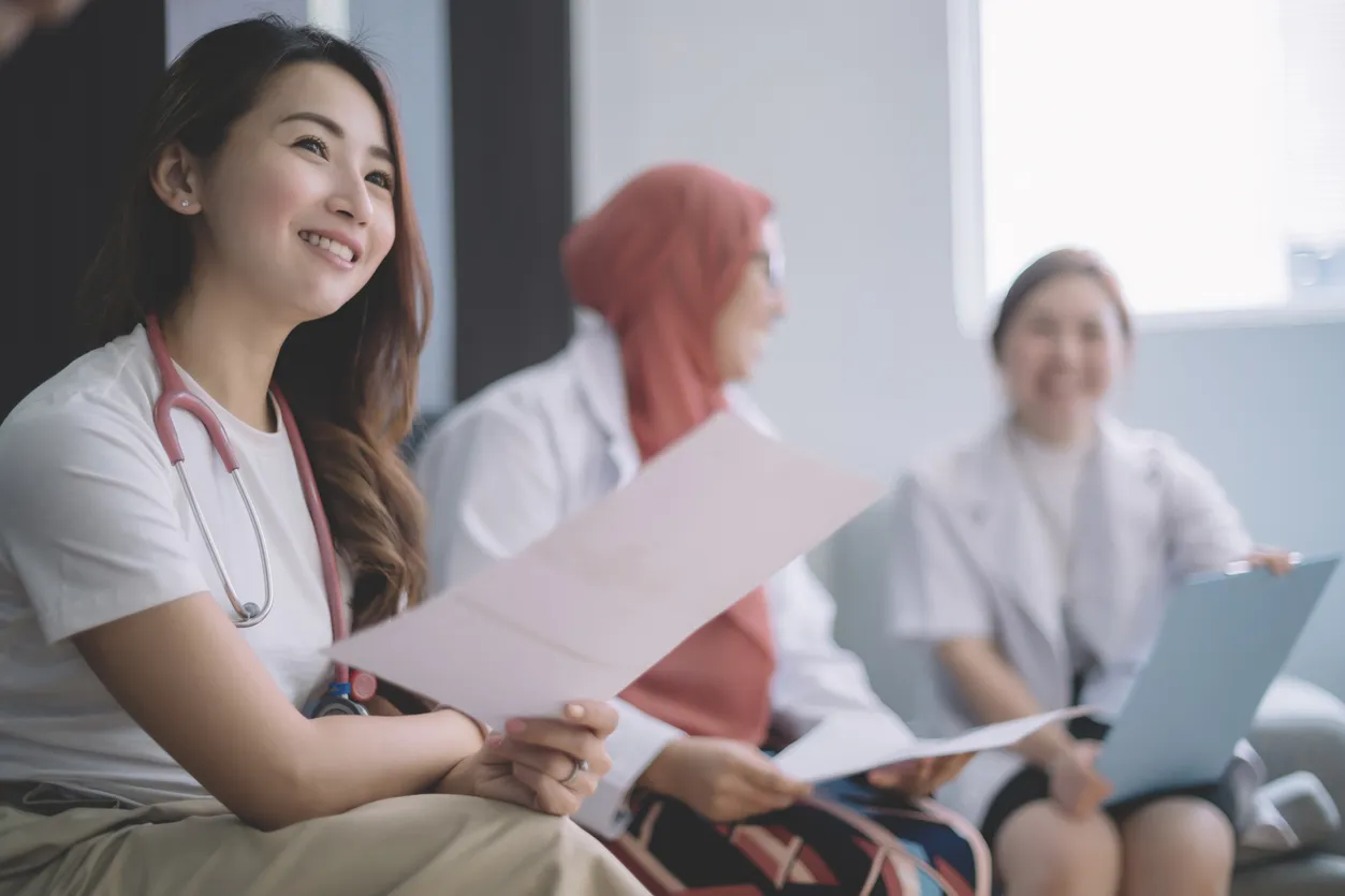Healthcare professionals reviewing papers together